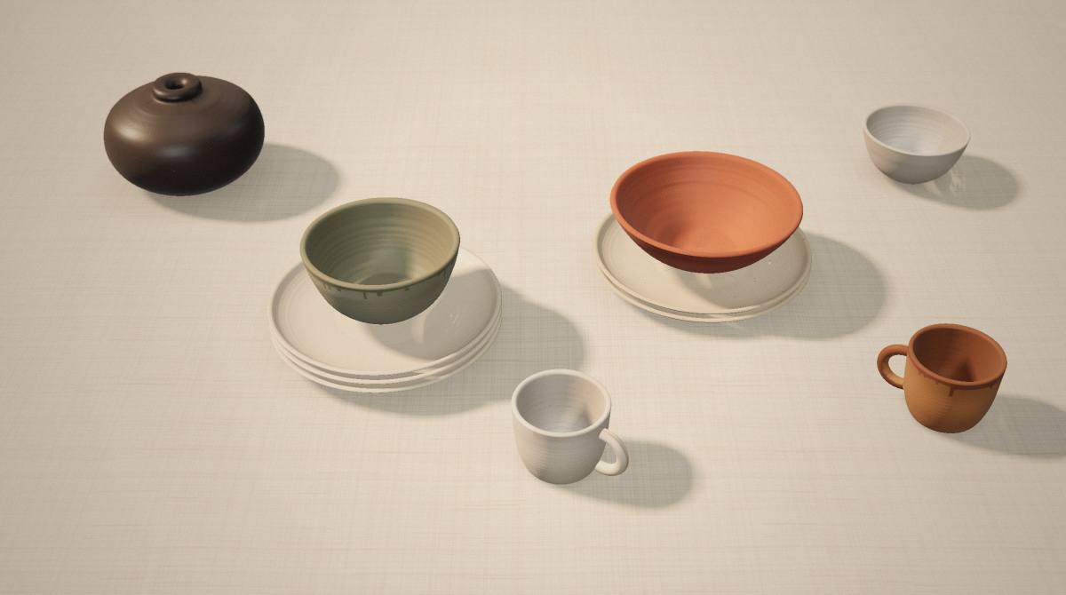 Bols, tasses et assiettes en céramique sur un fond clair, éclairés par une lumière douce
